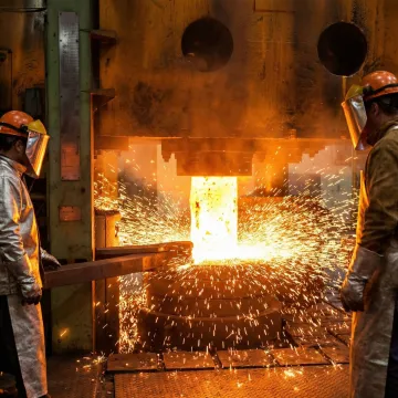 Custom metal forging operations at an industrial forge facility