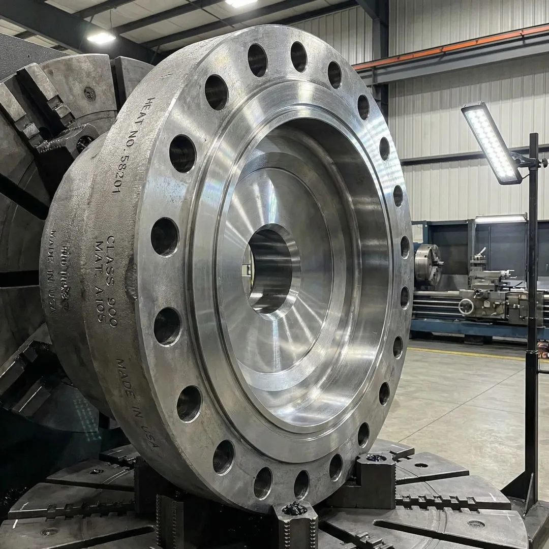 Precision-forged special purpose manway component in an industrial manufacturing facility