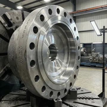 Precision-forged special purpose manway component in an industrial manufacturing facility