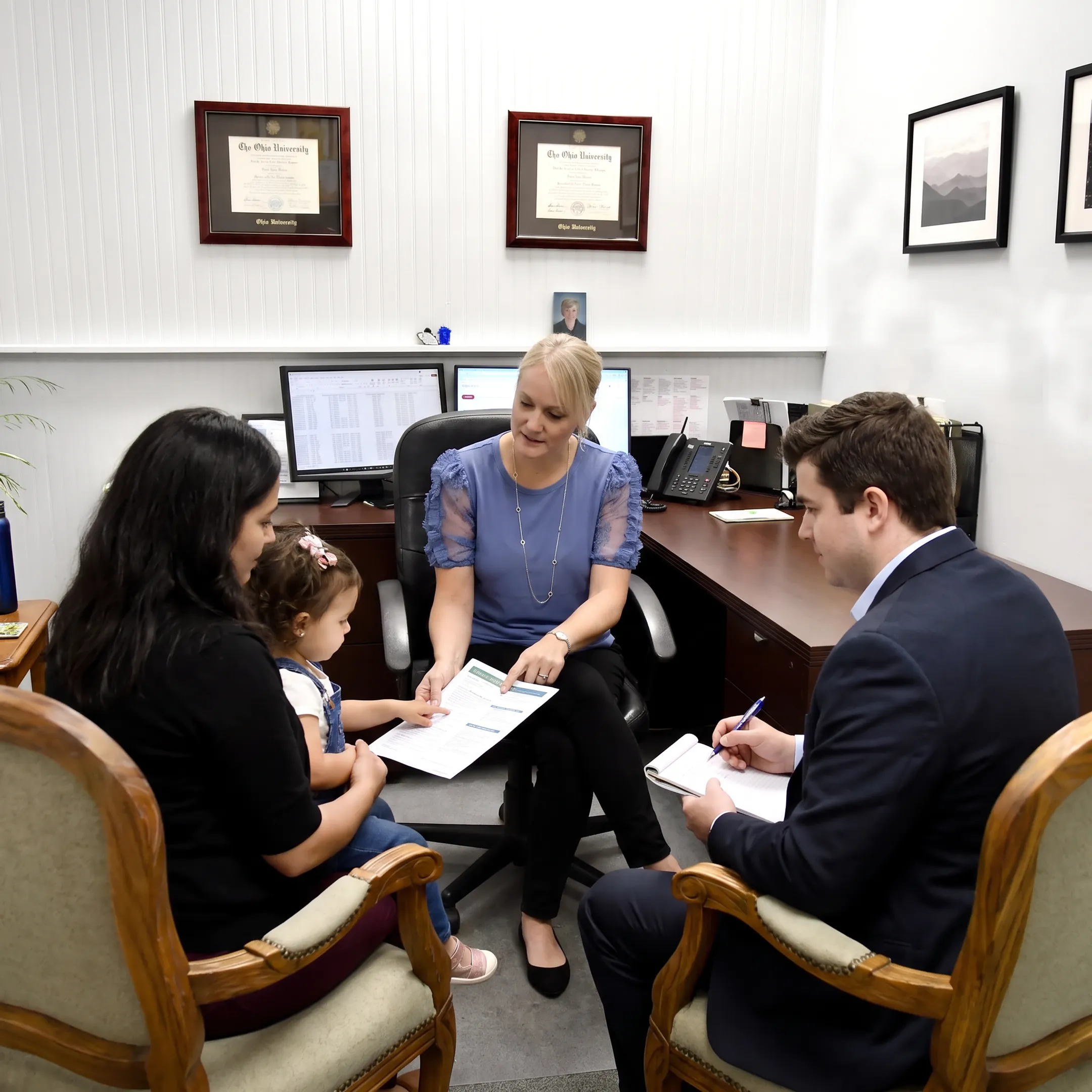 Insurance adviser reviewing health coverage options with clients