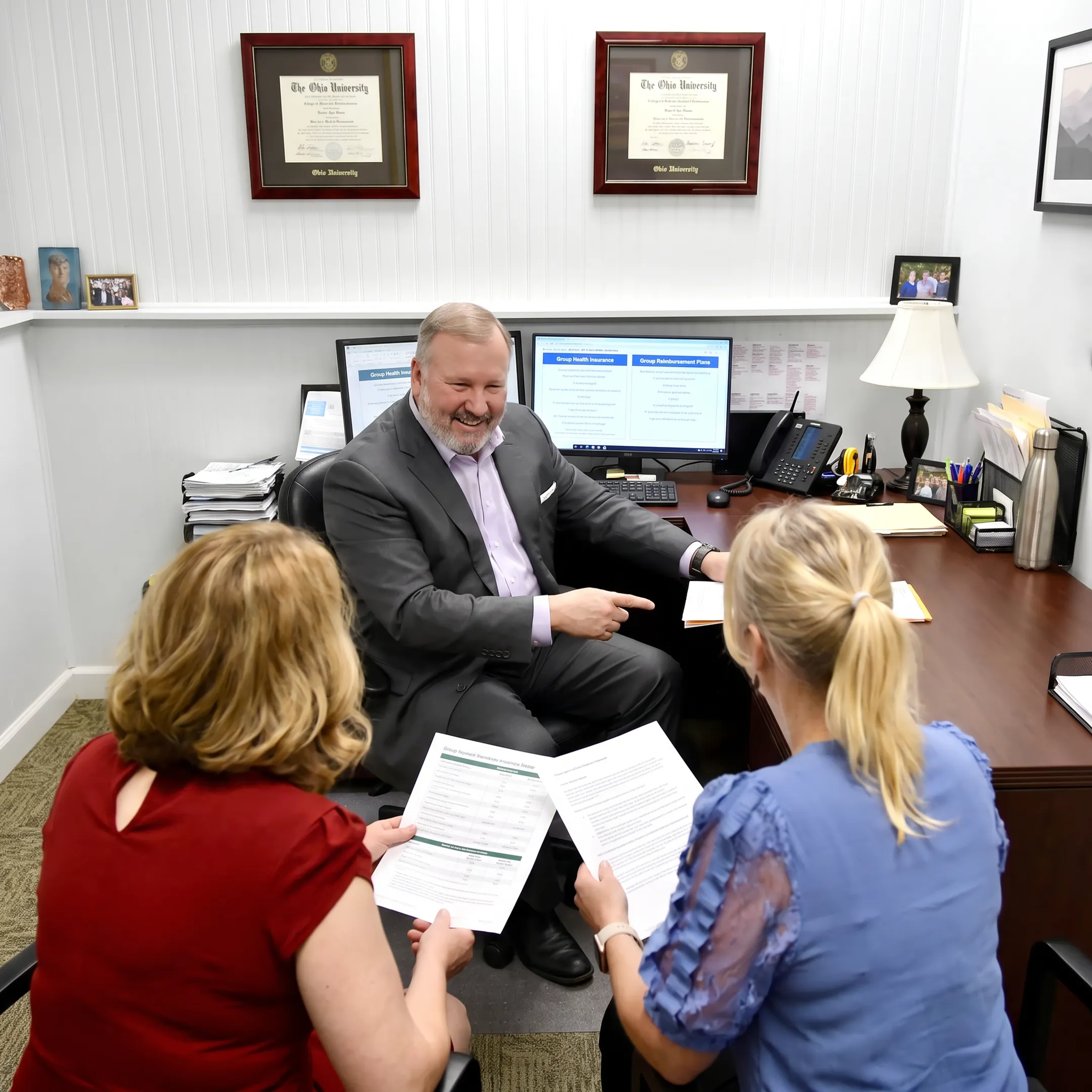 Benefits adviser explaining health plan options