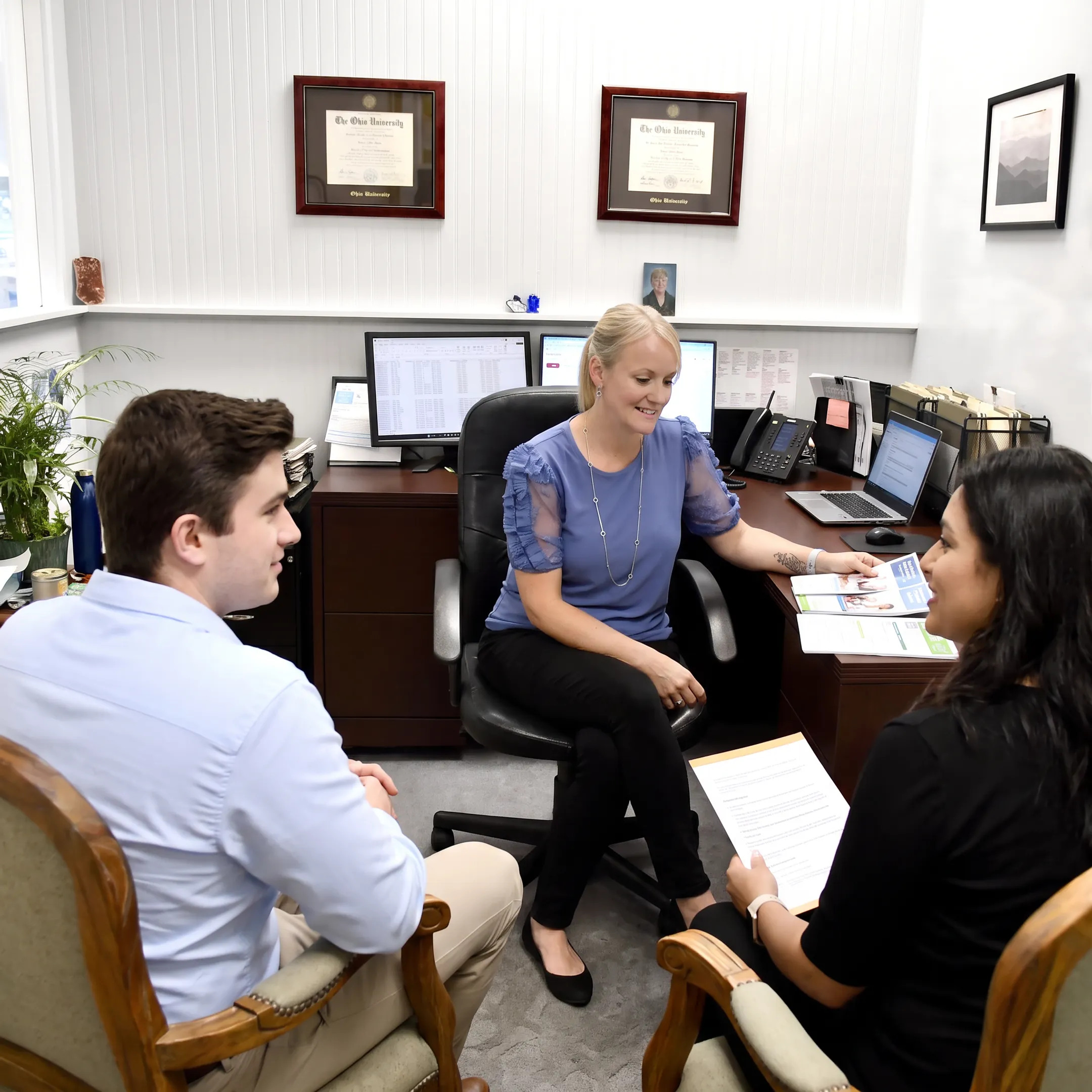 Client comparing health insurance plans with an adviser