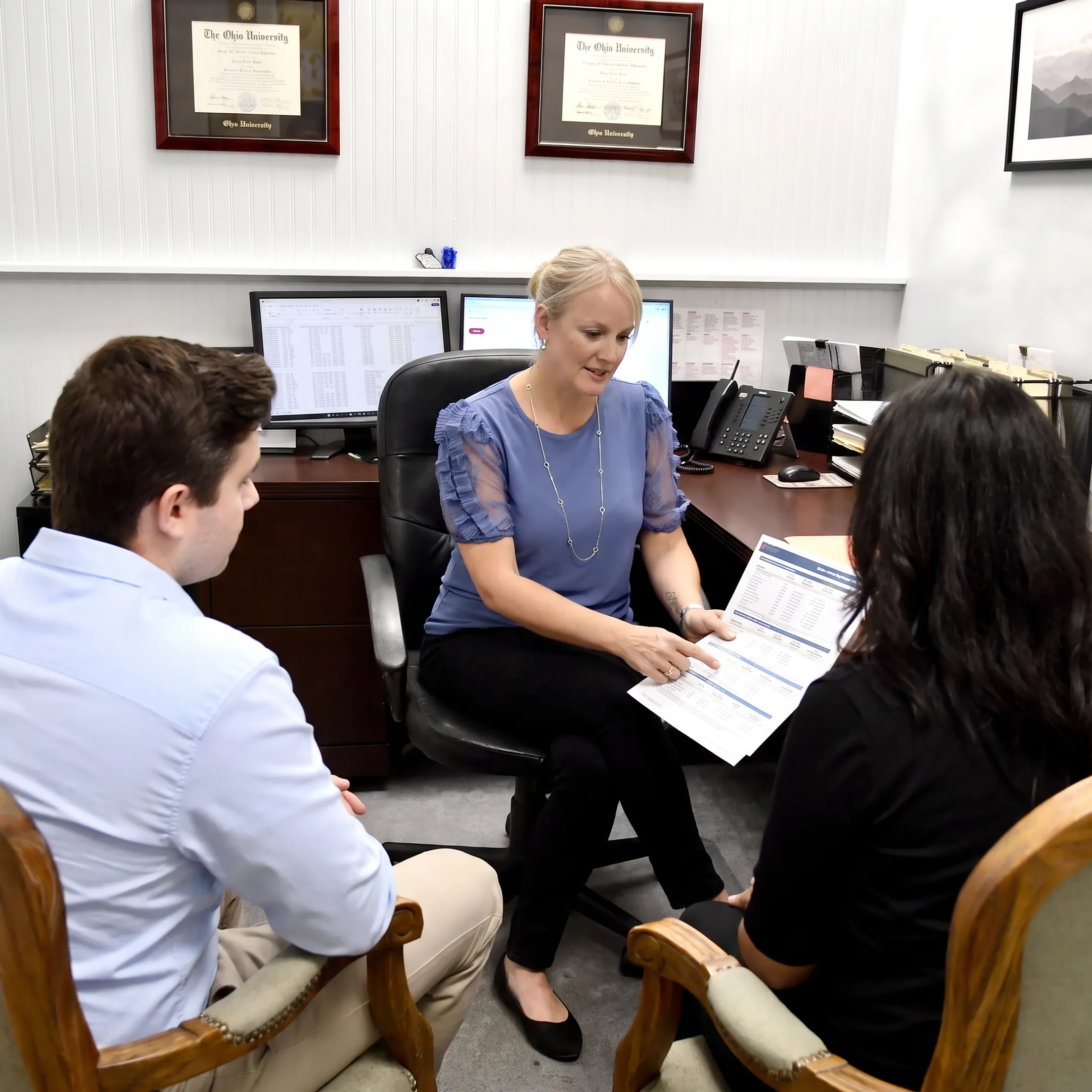 Adviser explaining insurance coverage to a client