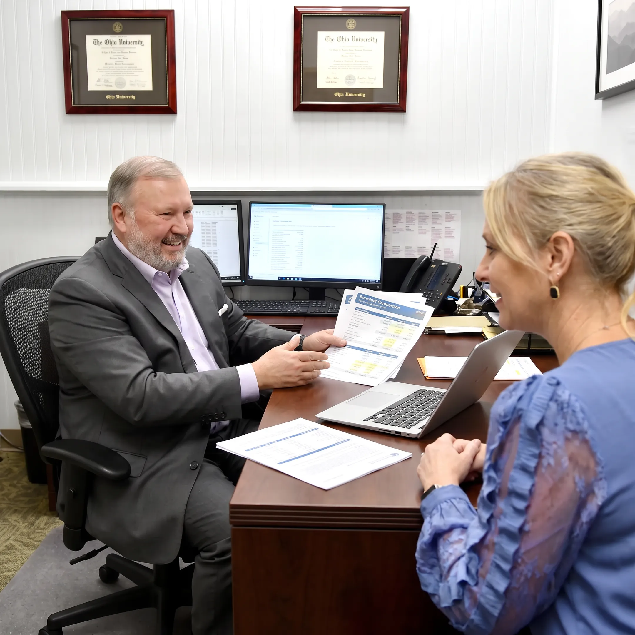 Adviser explaining insurance benefits to a client