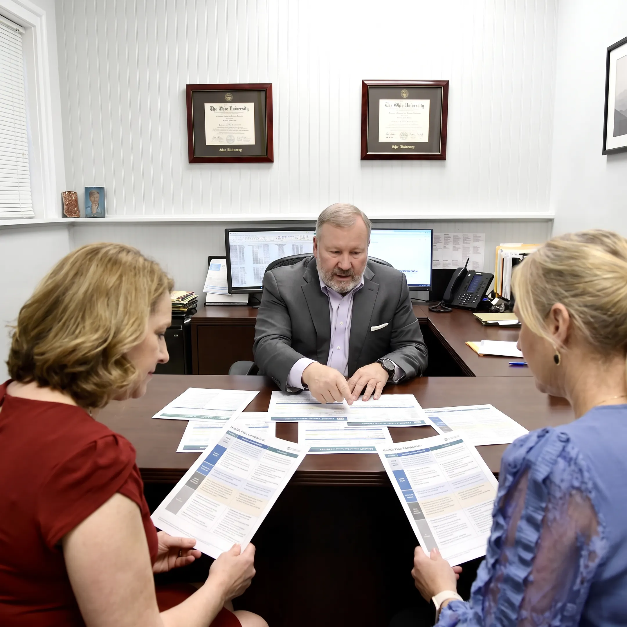 Agent explaining health plan benefits to a couple