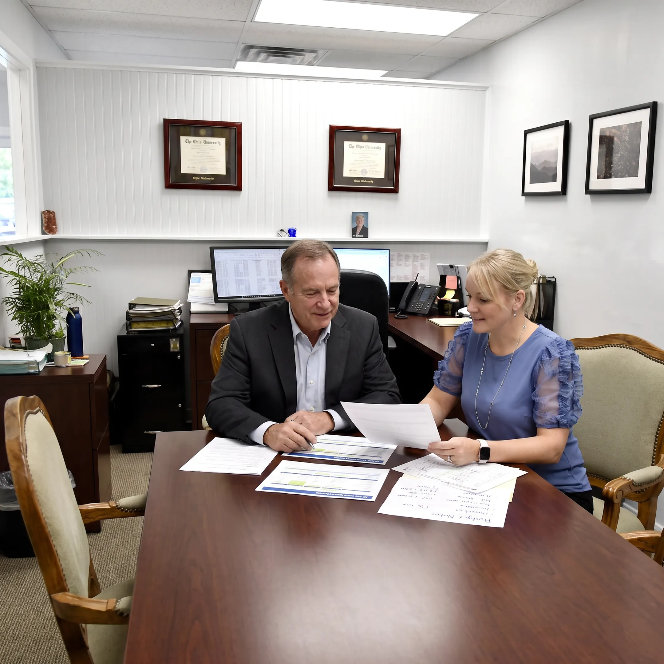 Advisor reviewing employee benefits with business owner