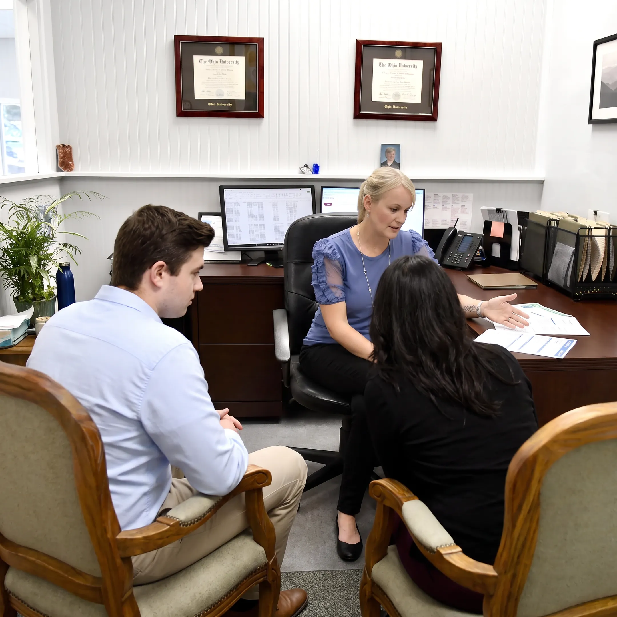 Insurance advisor discussing coverage options with clients