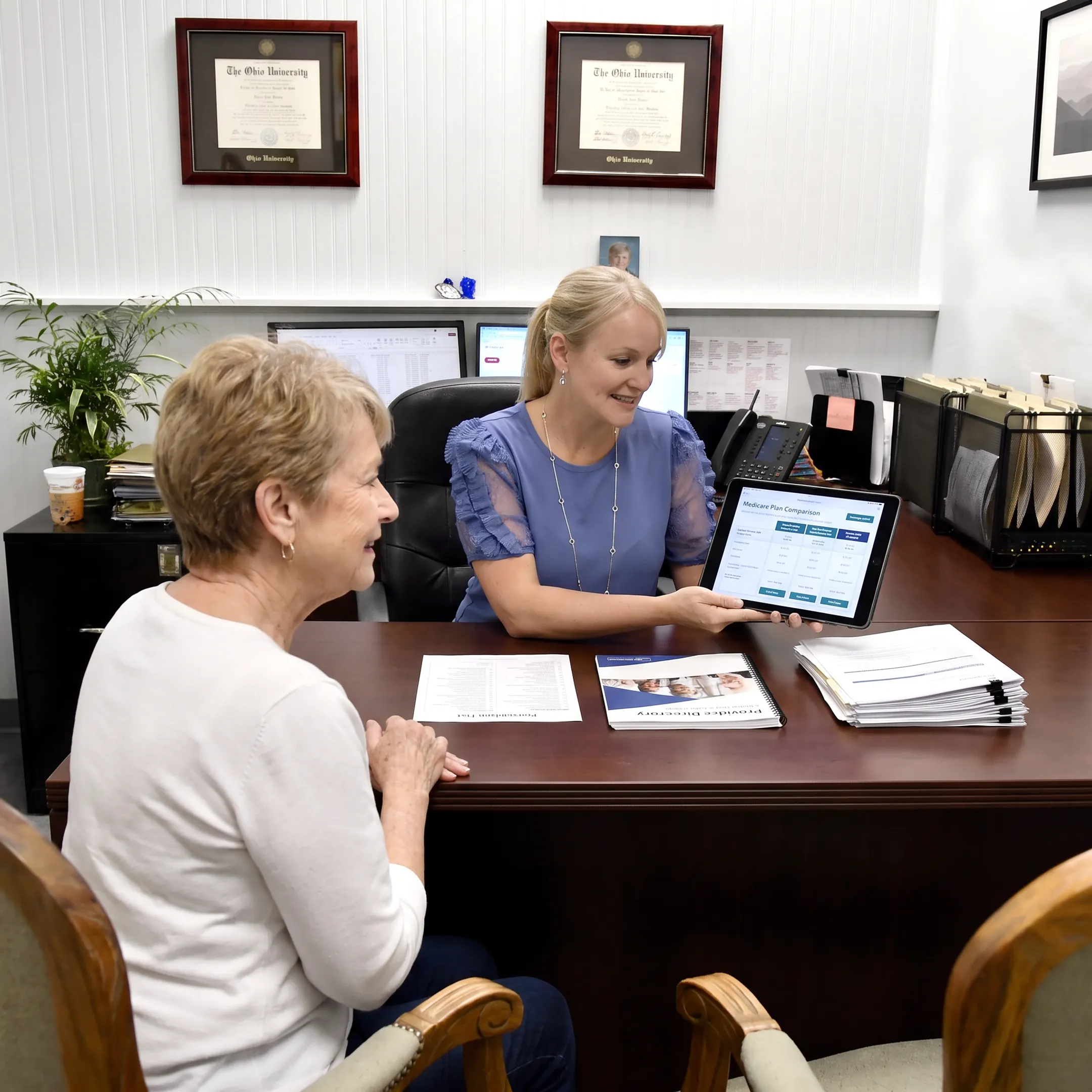 Medicare advisor explaining plan choices to a client