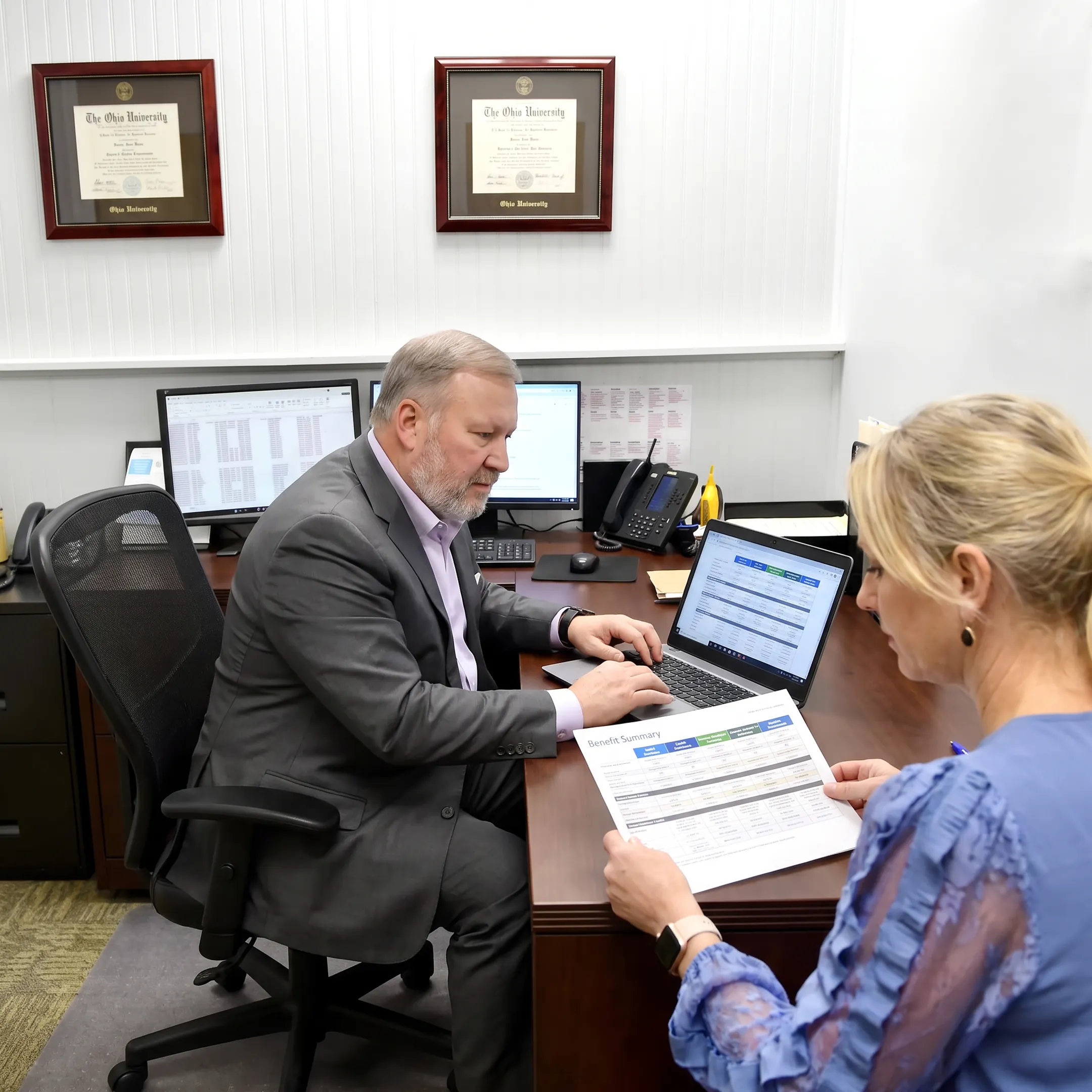 Insurance agent reviewing health plan choices