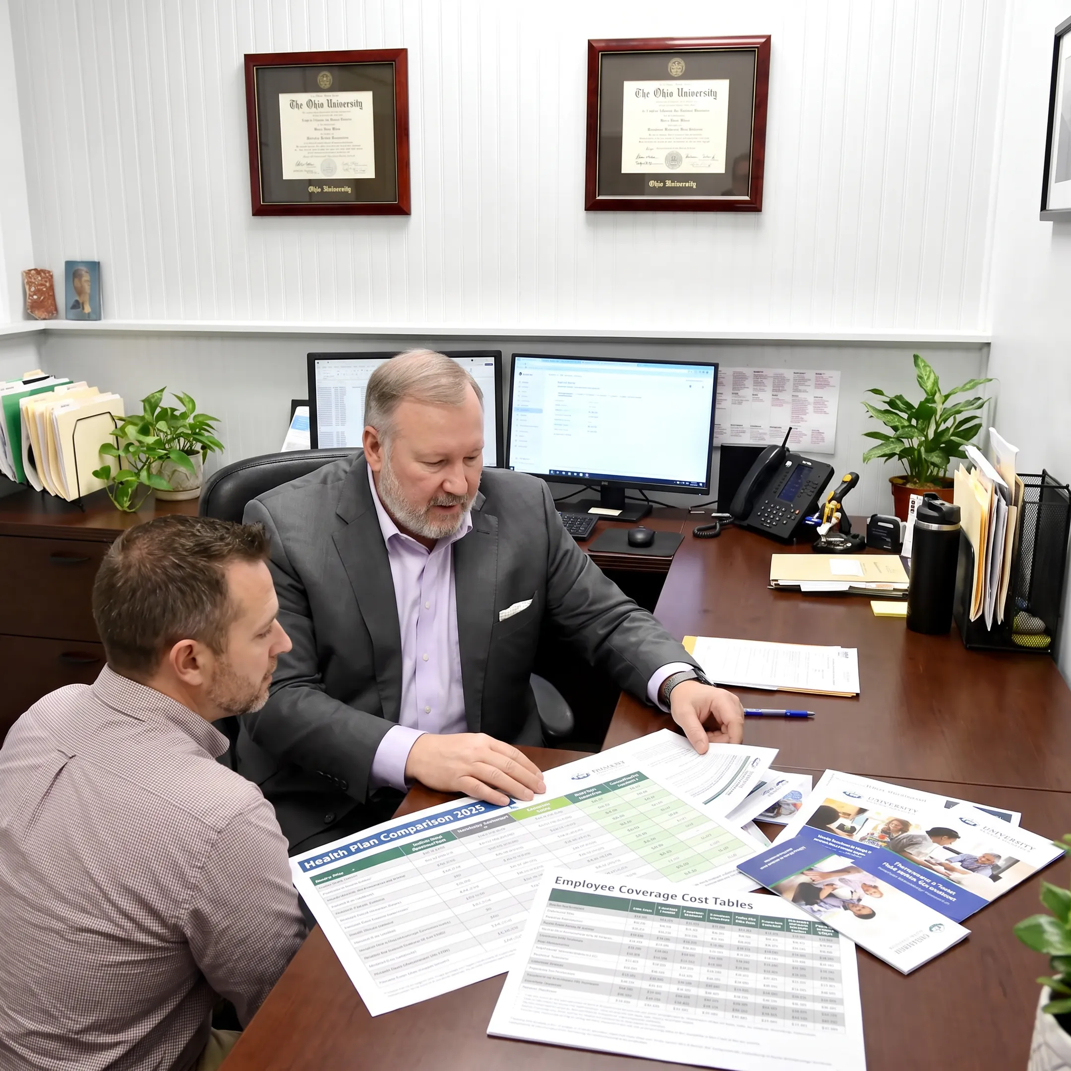 Advisor discussing health benefit options with business owner