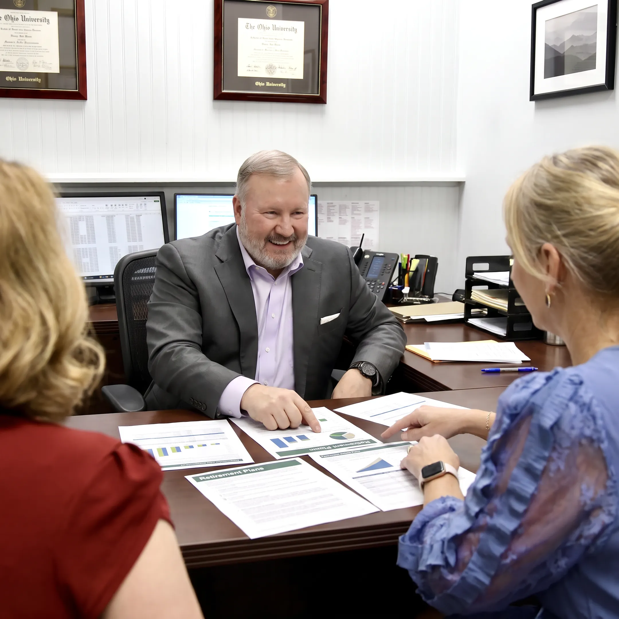 Adviser explaining retirement plan options to a small business owner