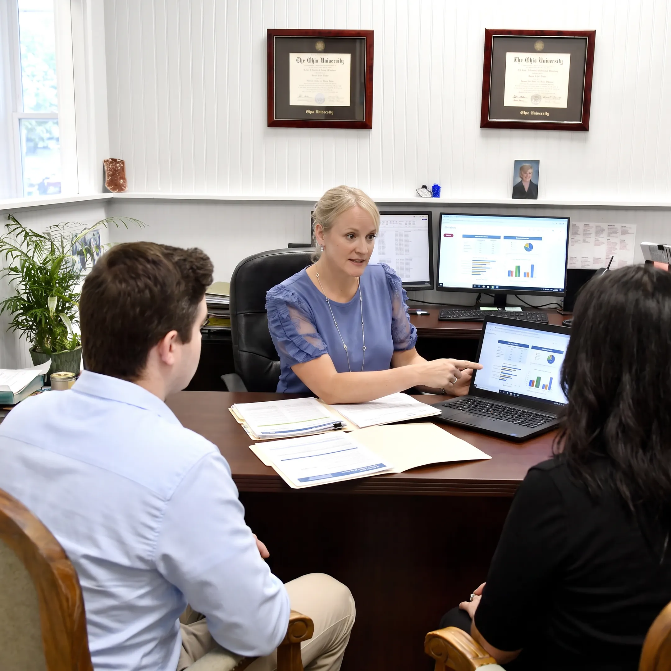 Adviser explaining benefit options to employer