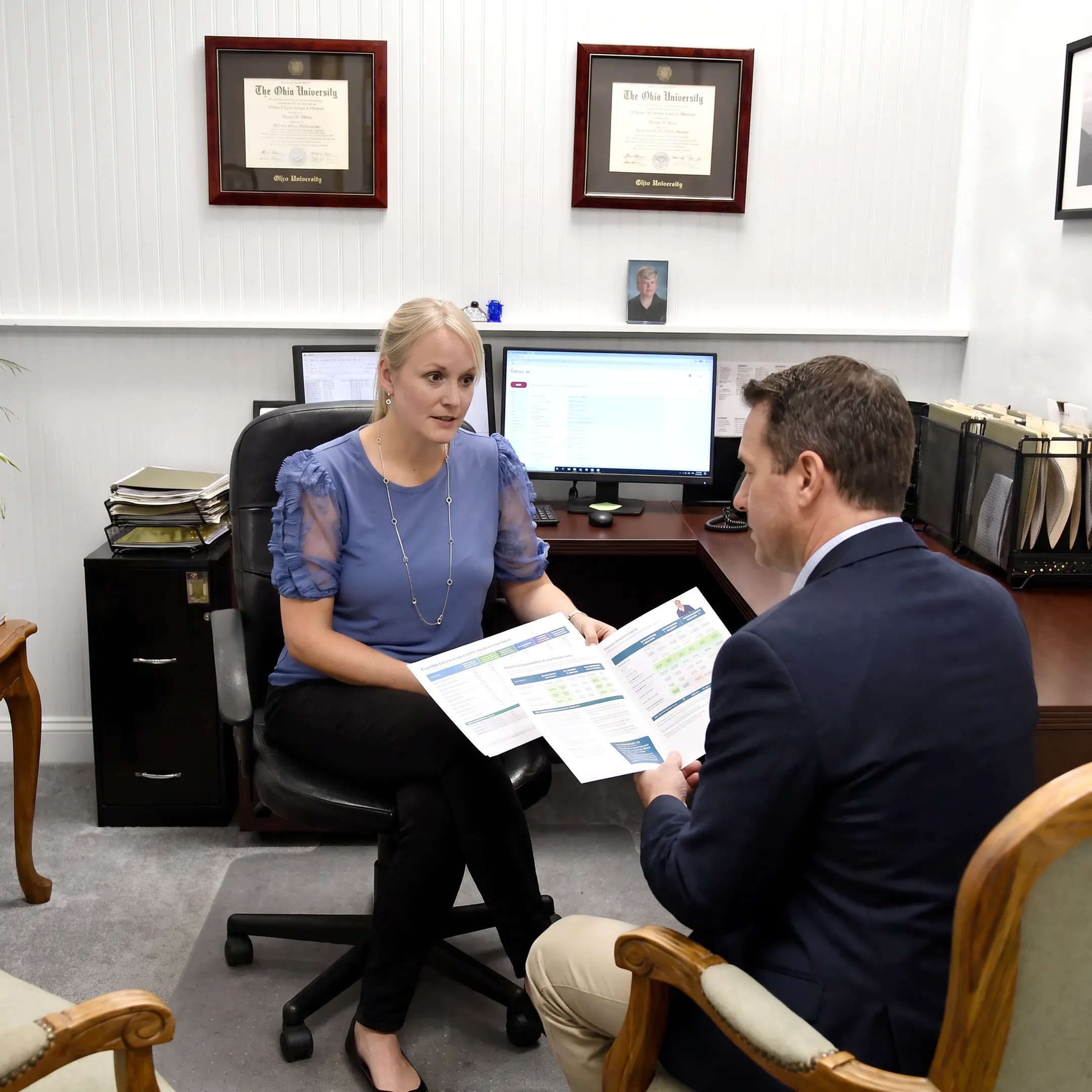 Advisor explaining employee benefits plan to business owner