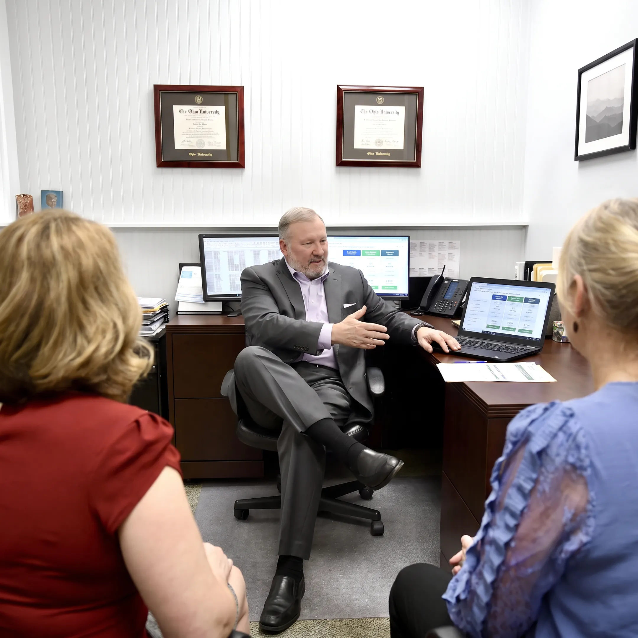 Insurance agent explaining health plan comparisons