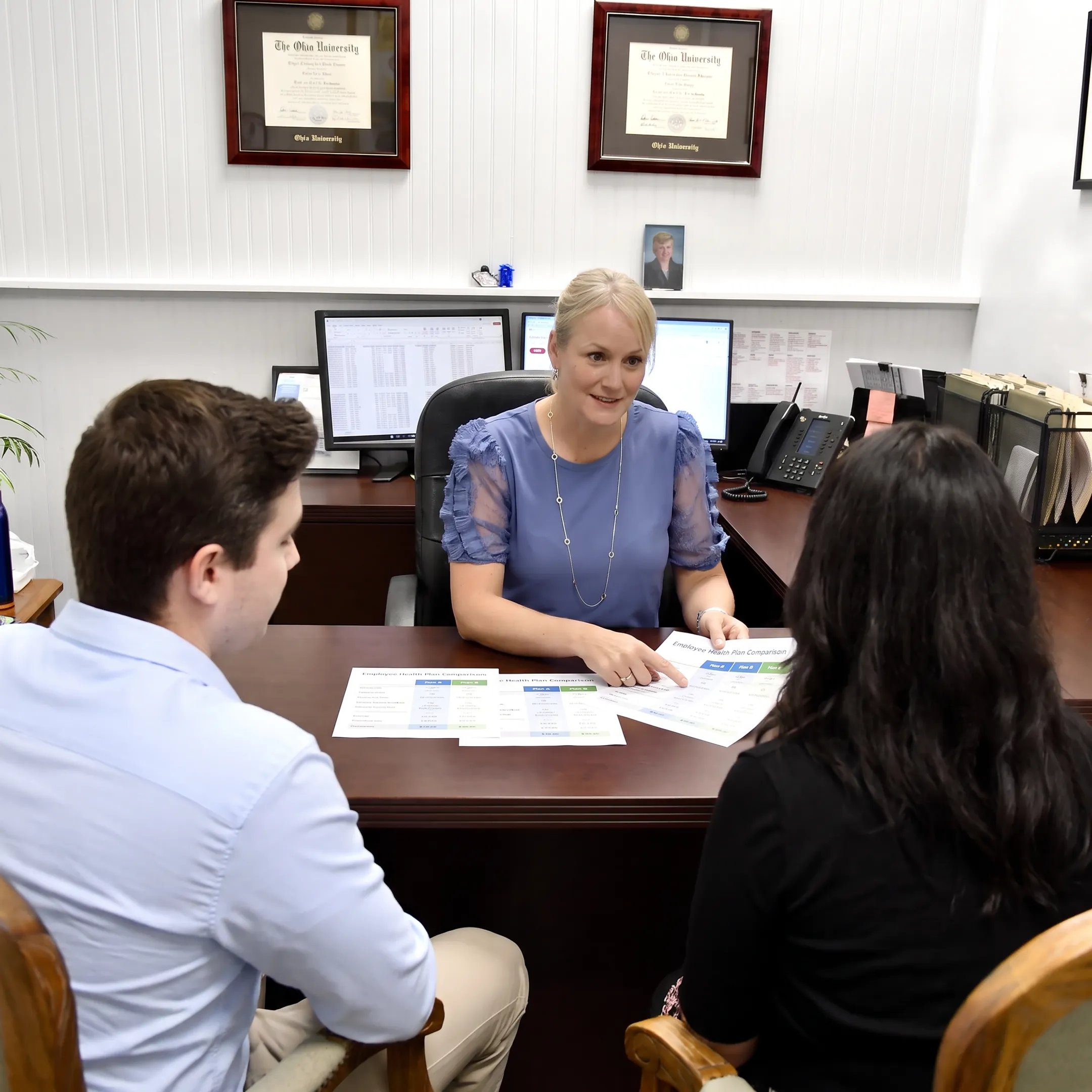 Adviser explaining small business health plan options