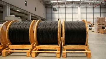 Corrugated steel wire reels stacked on shipping pallet for outbound freight