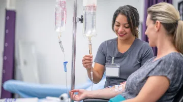 Patient receiving intravenous chelation therapy in clinical setting