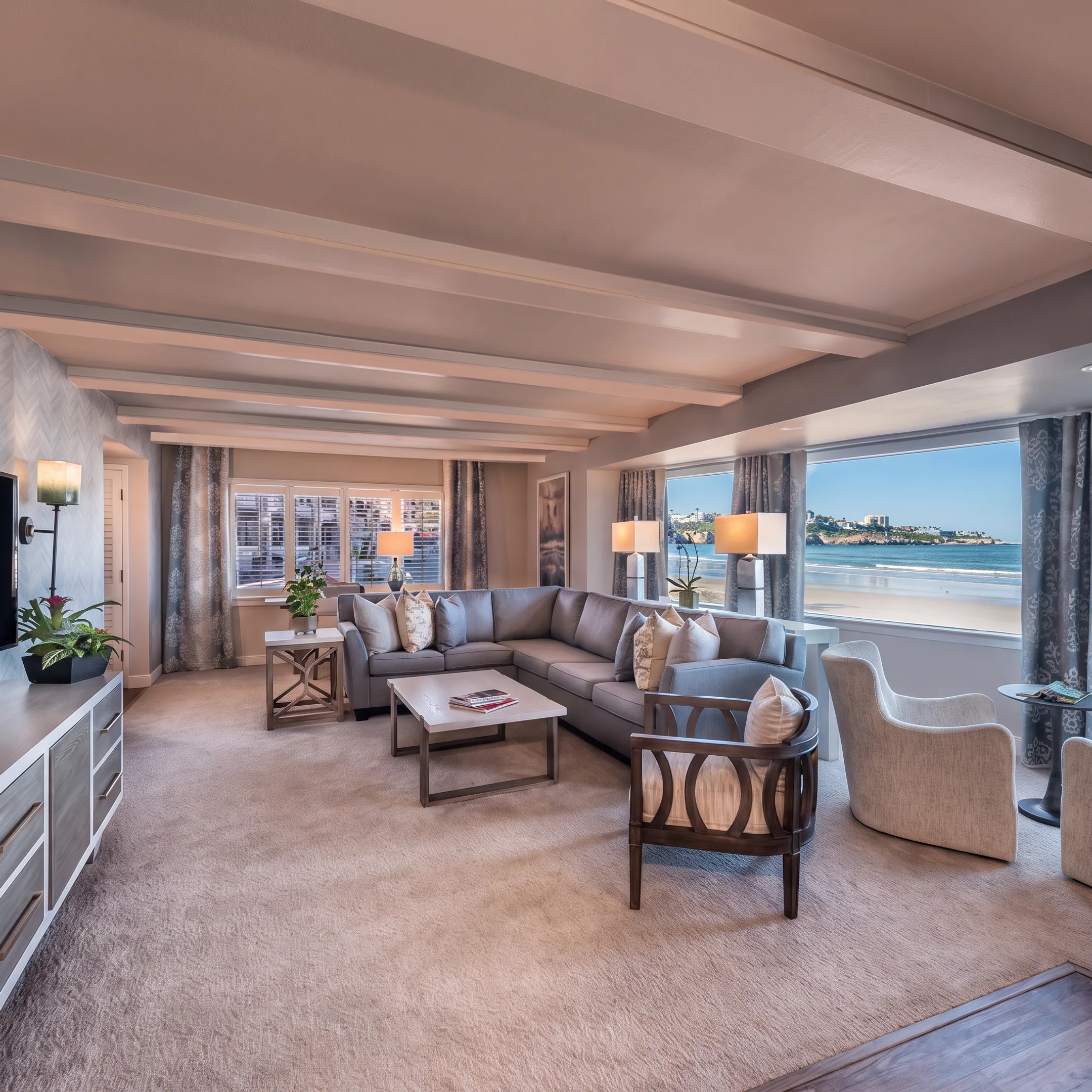 Custom handcrafted furniture arranged in an elegant coastal living room