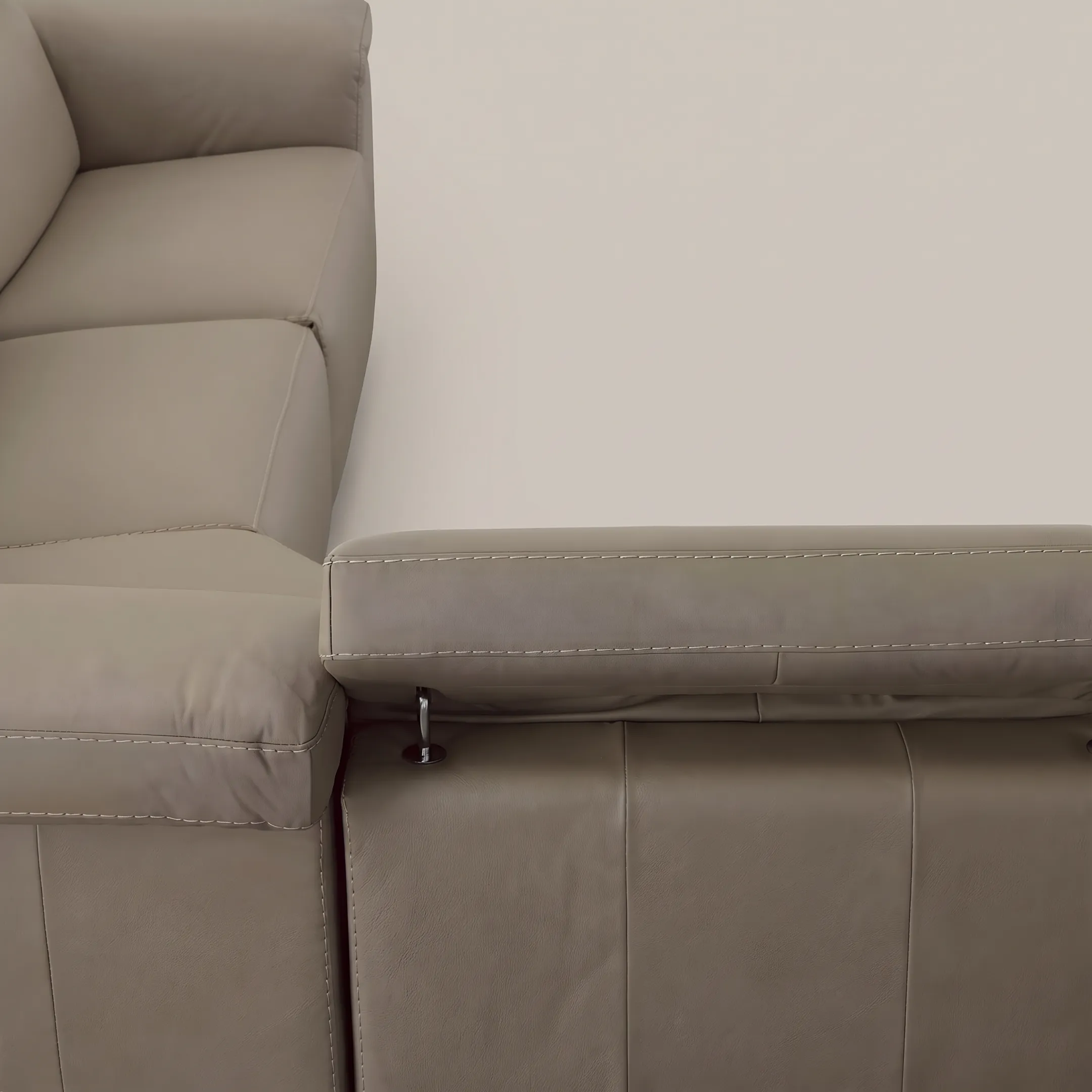 Detailed view of handcrafted Italian leather sofa stitching and tailored cushions