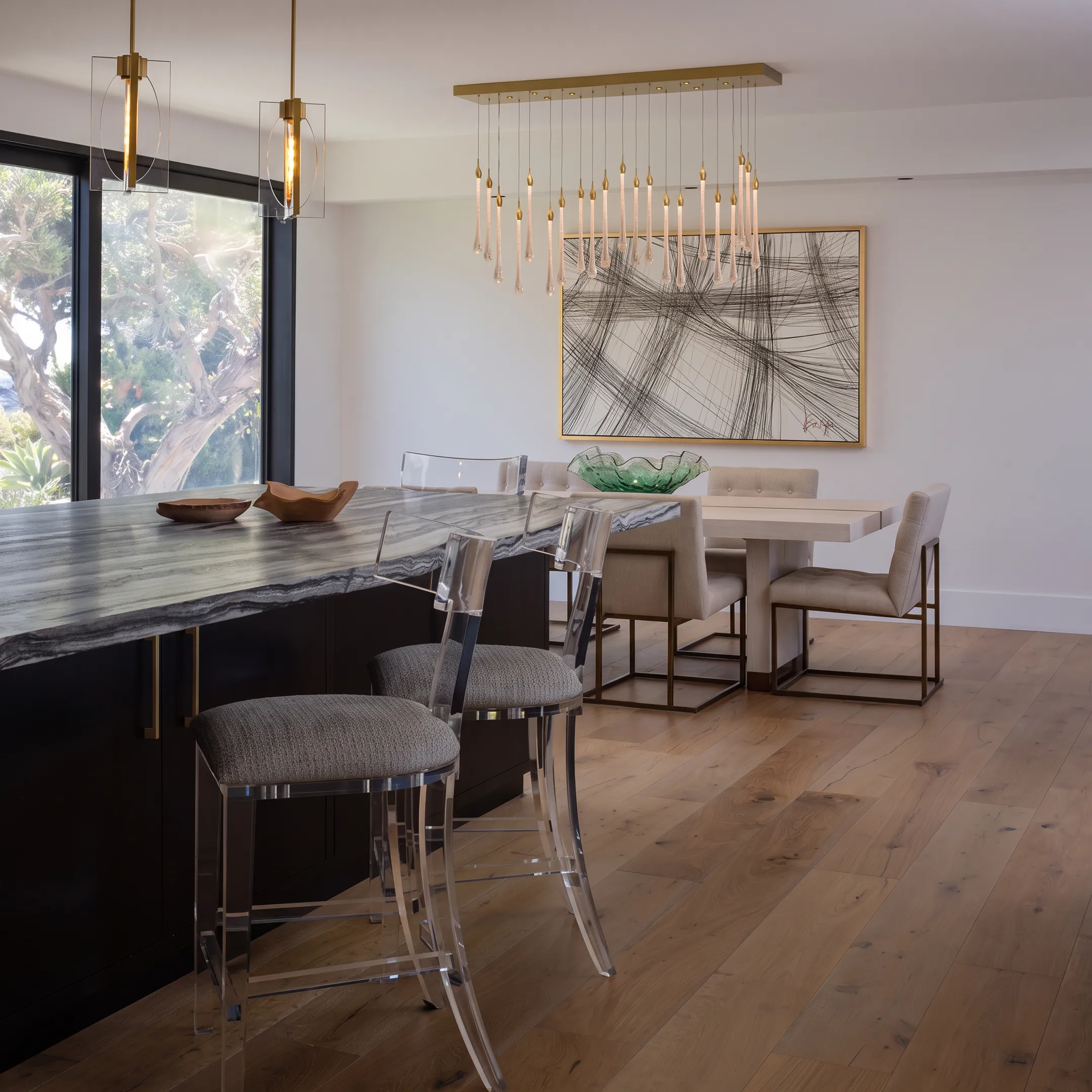Custom luxury dining room featuring solid walnut table and upholstered designer chairs