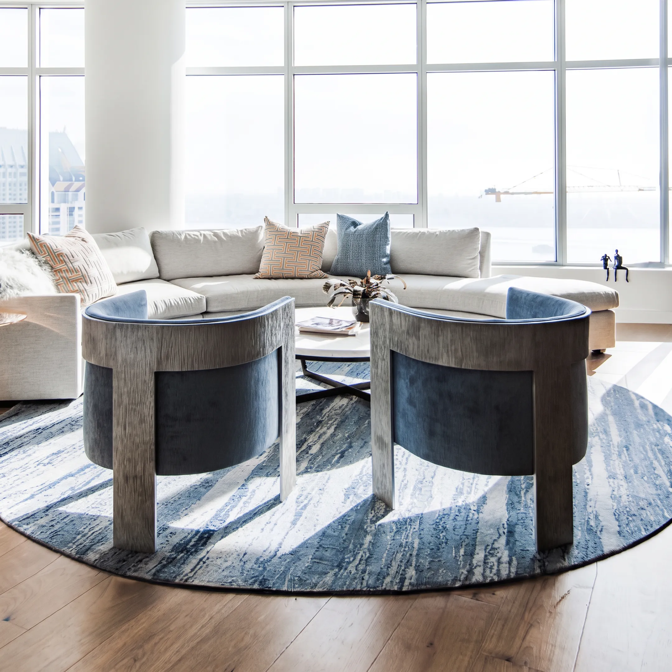 Meticulously staged open-concept dining and living space displaying high-end furnishings