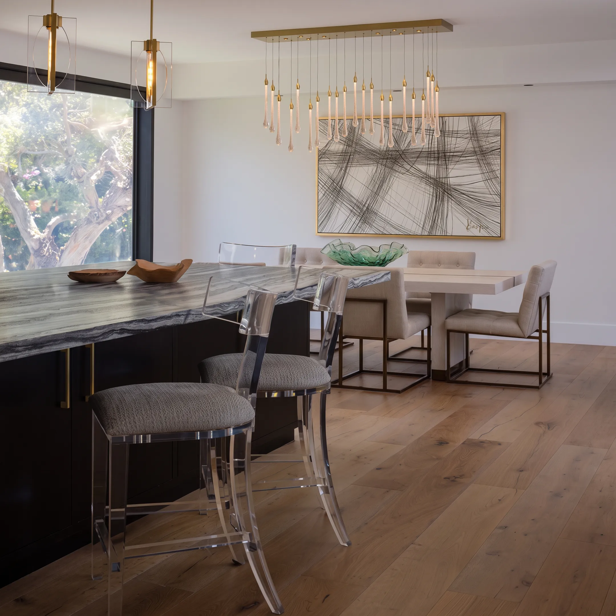 Curated open-plan dining and living area with custom furniture