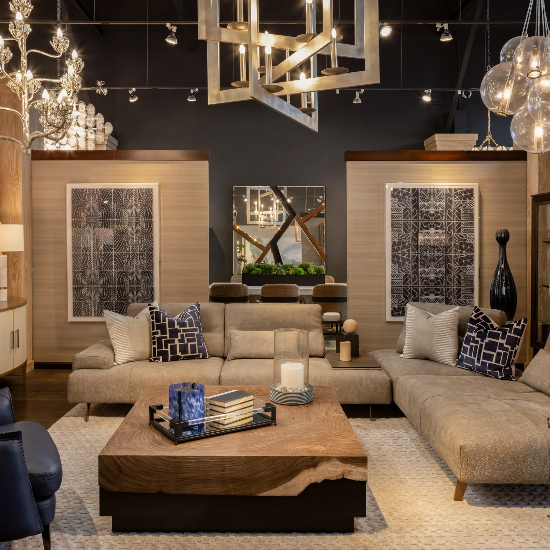 Luxury furniture showroom featuring custom tables and leather seating in San Diego