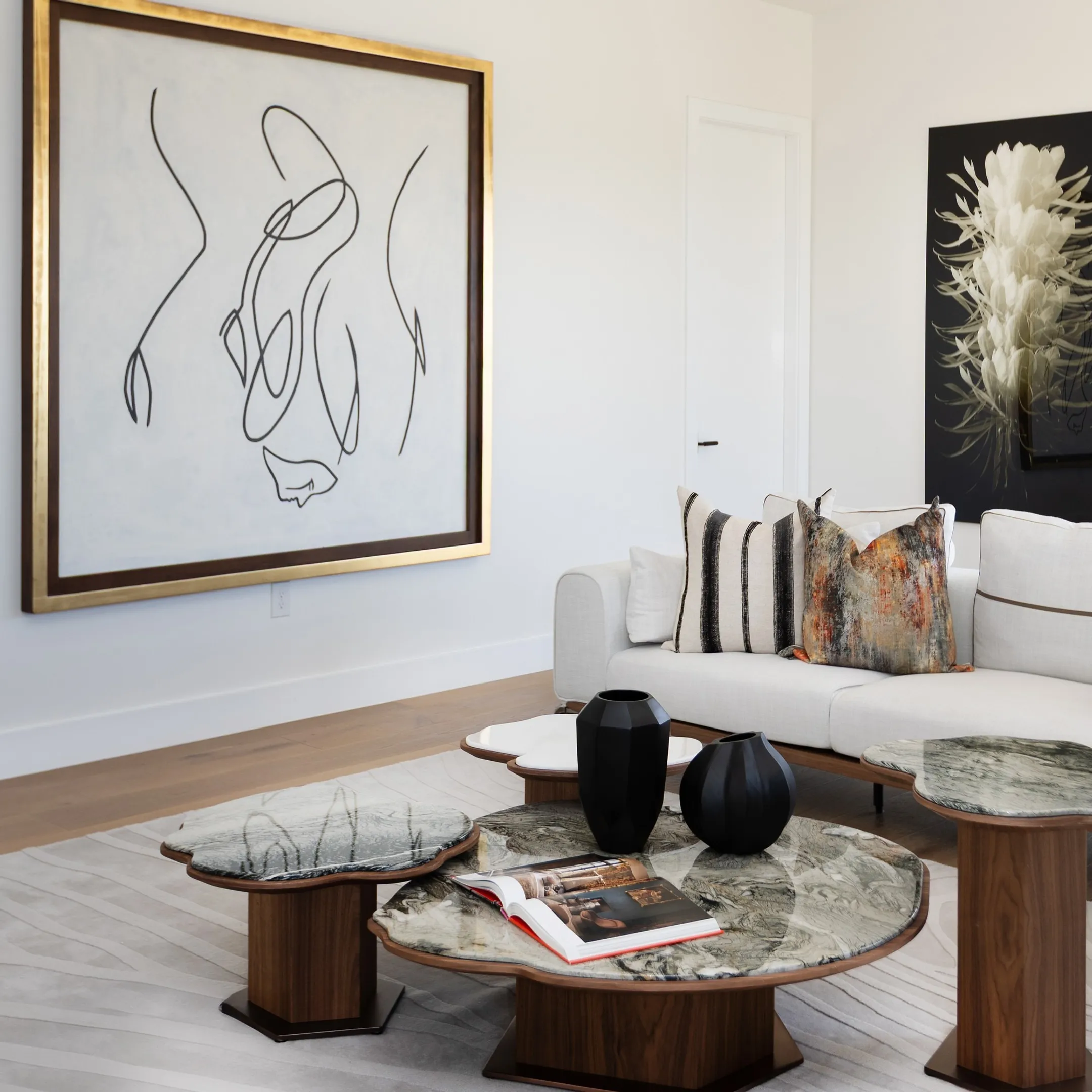 Luxury staged living room in an Orange County residence featuring contemporary custom furniture and warm lighting