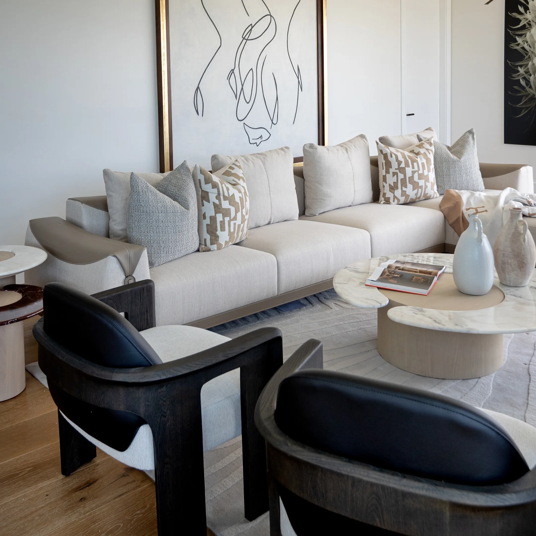 Custom luxury living room interior featuring tailored sofa and artisan wood coffee table