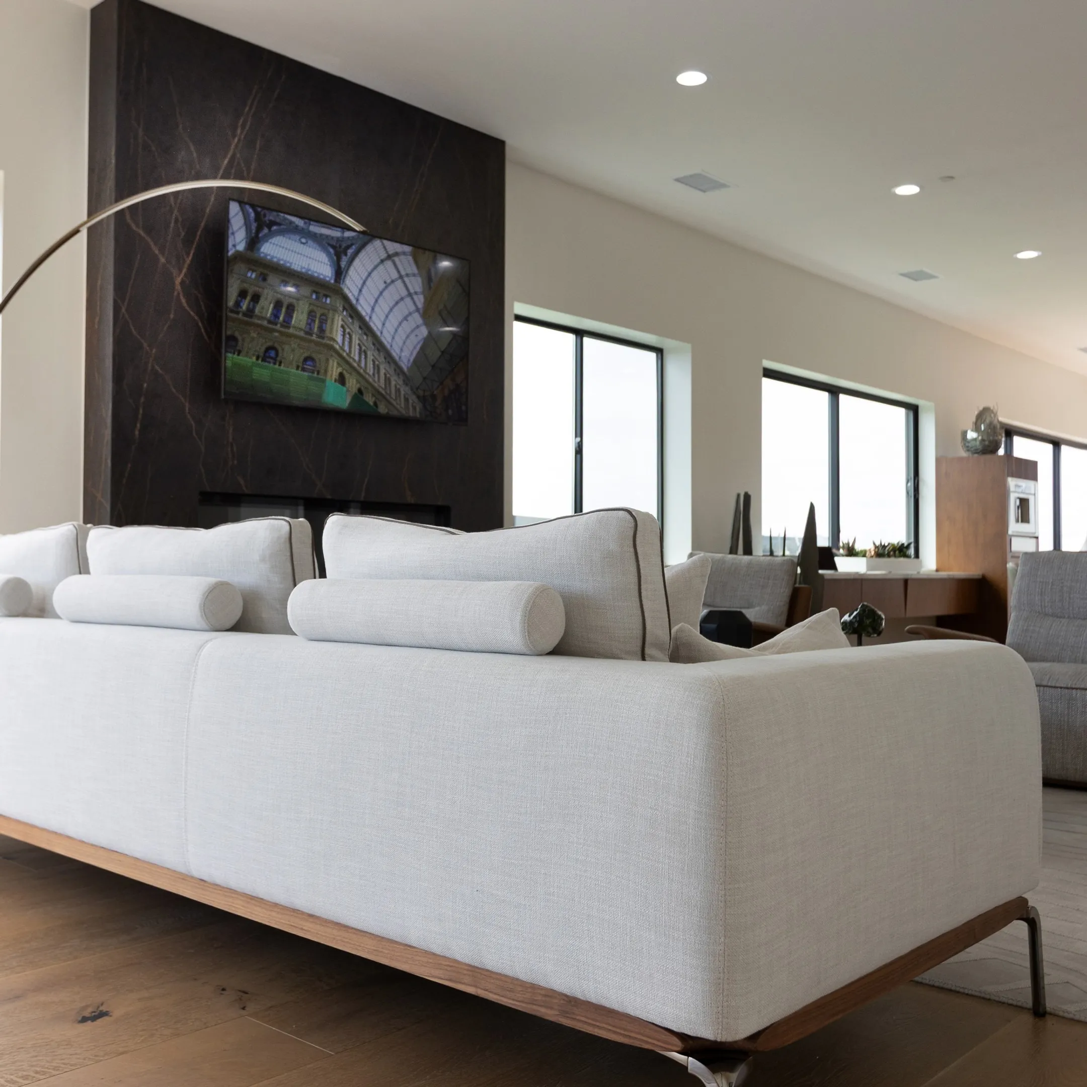 Spacious luxury living room with bespoke furniture and curated lighting