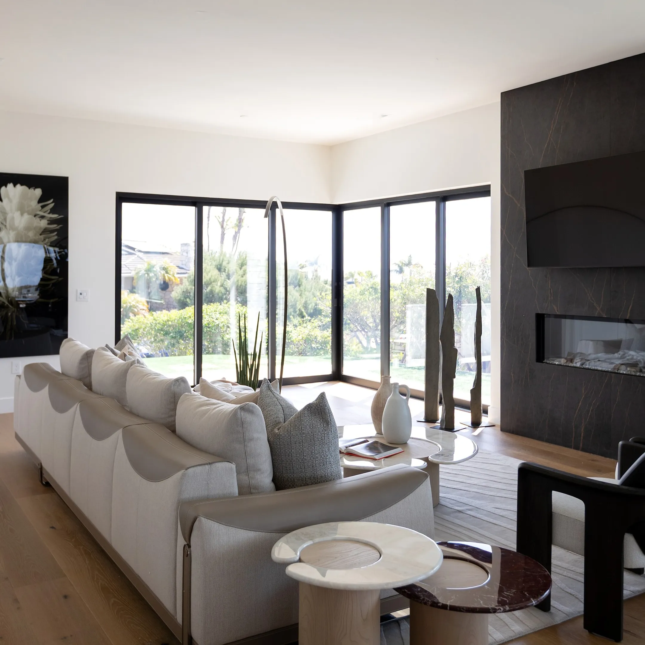 Spacious luxury coastal living room designed by San Diego interior designers featuring custom handcrafted furnishings