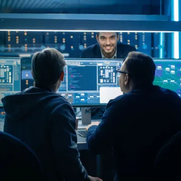 Cybersecurity team monitoring business network threats
