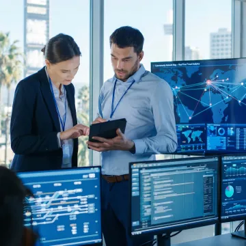 Cybersecurity consultant reviewing business security systems