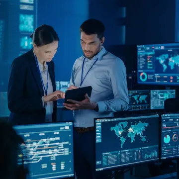 Cybersecurity risk assessment team reviewing network security data