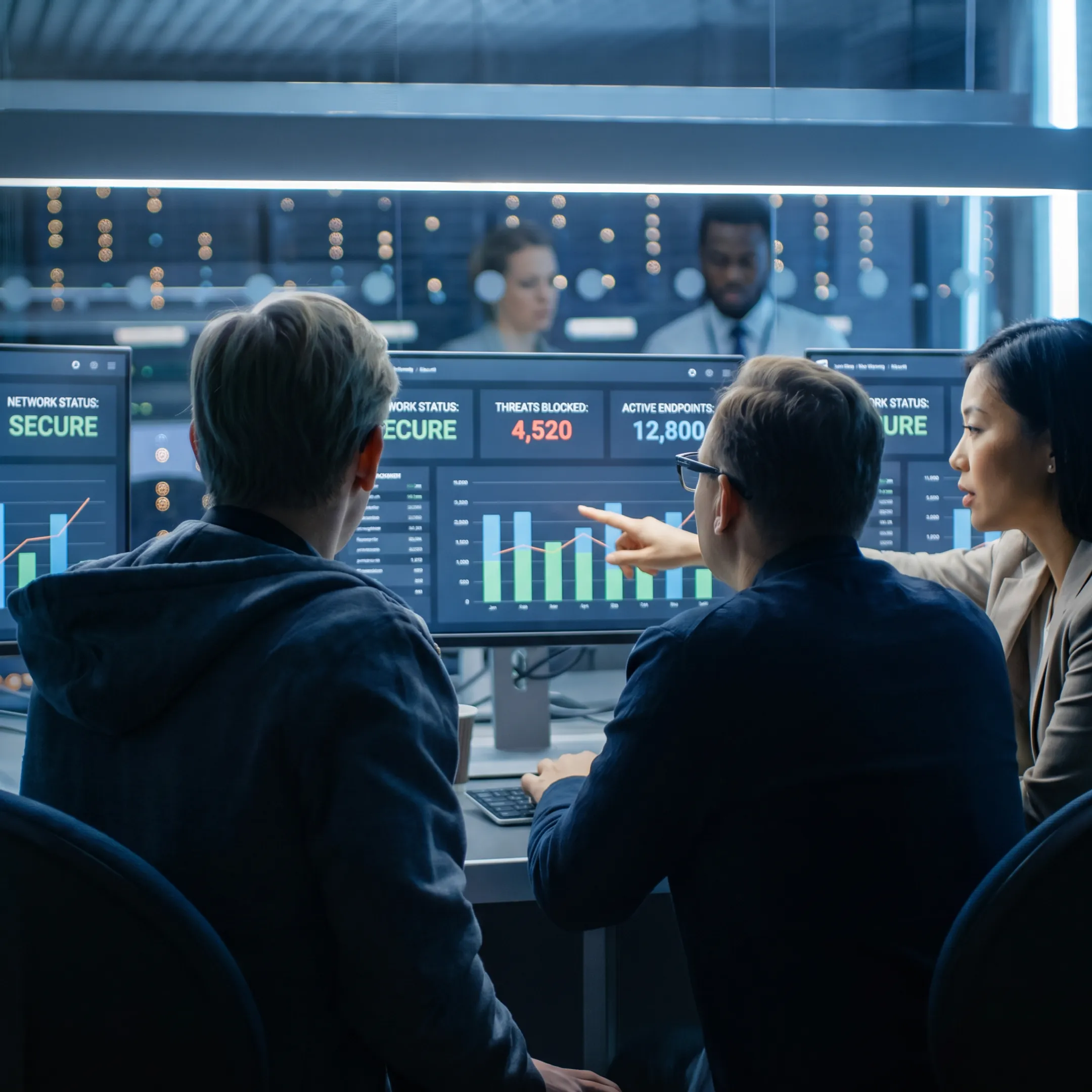 Cybersecurity professionals monitoring business systems and digital threats