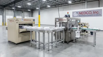 NEDCO automated t-shirt folding and finishing line equipment in production facility
