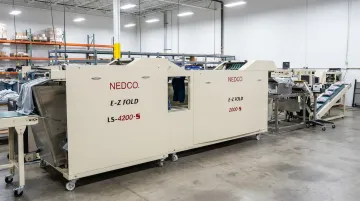 NEDCO E-Z Fold modular garment finishing equipment line with folding and bagging systems