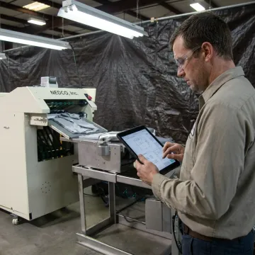 Engineer reviewing packaging machinery process