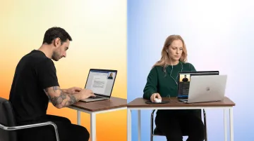 Virtual body doubling video call session with two remote workers focusing independently