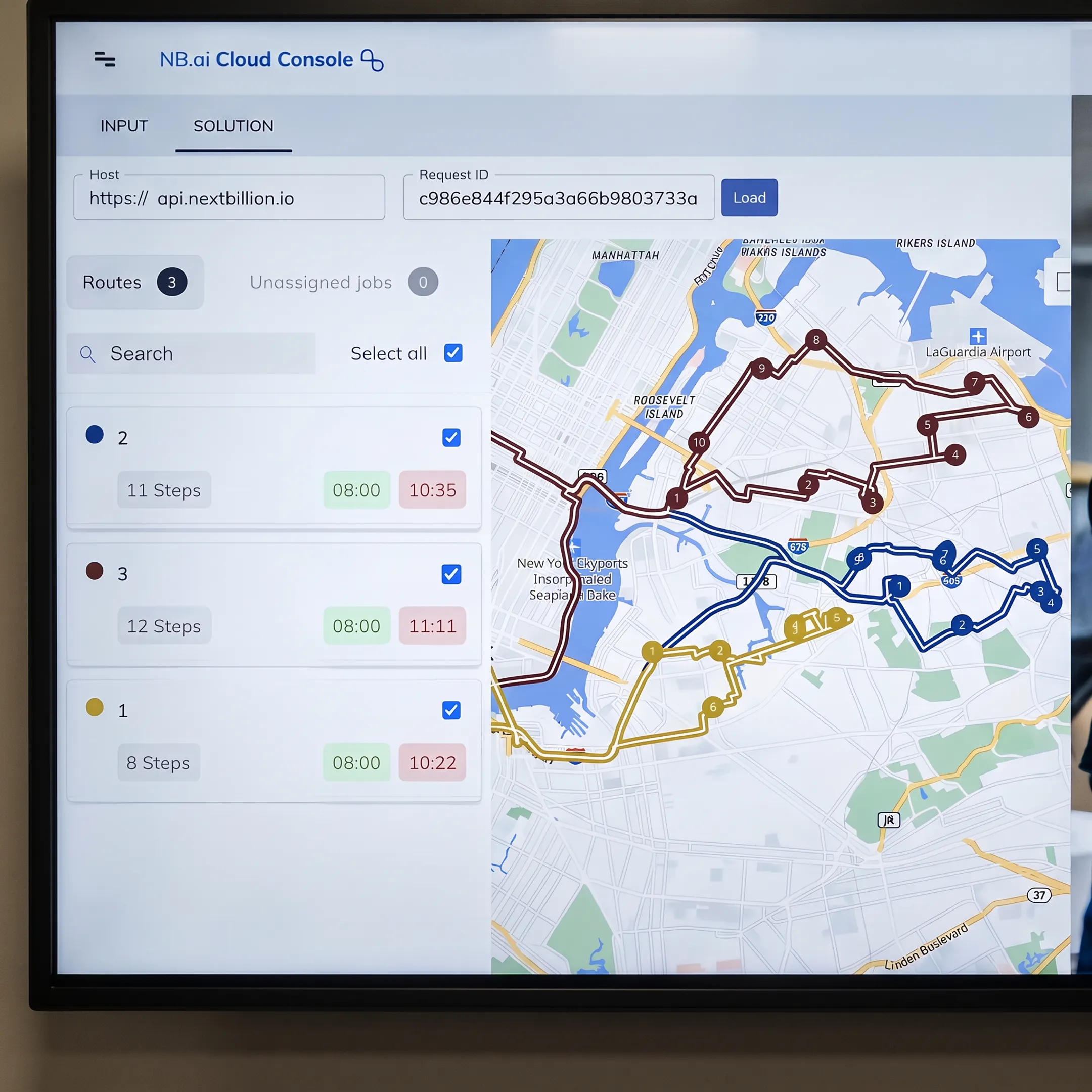 Retail delivery manager reviewing optimized grocery routes on a logistics dashboard