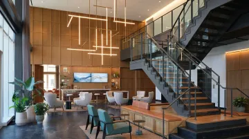 Modern Class A Midtown South office building lobby with premium finishes and amenity spaces