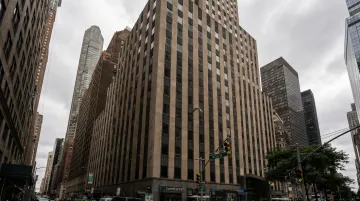 Distressed Manhattan office building exterior showing aging commercial real estate asset