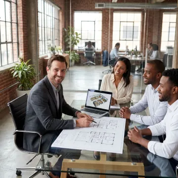 Team reviewing office leasing options