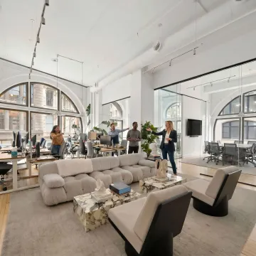Startup team touring modern NYC office space