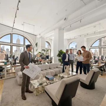 Team reviewing office lease options and touring space