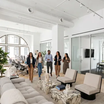 Startup team touring a flexible office space
