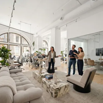 Startup team touring flexible office space