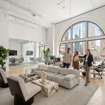 Startup team touring modern office space