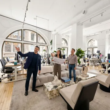 Team touring modern commercial office space