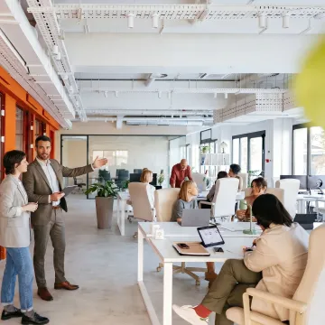 Startup team touring a flexible office suite
